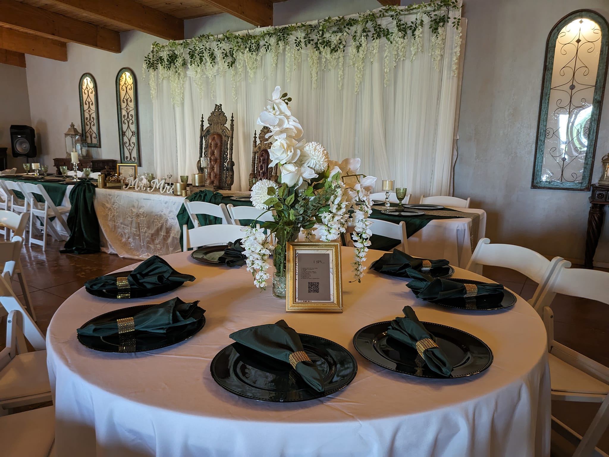 white and emerald green table scape for wedding